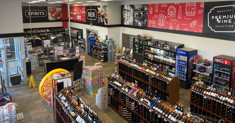 Warwick Printing installed a liquor store wall mural in a single day using Drytac ReTac wall media, despite having to work around shelves full of fragile stock.